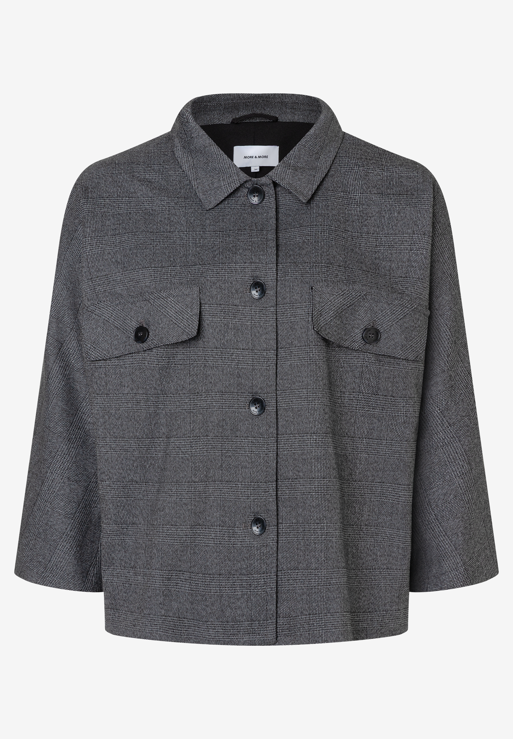 Ein karierter MORE & MORE Blazer mit Webware und drei Knöpfen. Ein karierter MORE & MORE Blazer mit Webware und drei Knöpfen.