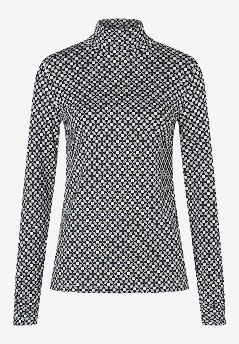 Ein MORE & MORE Oberteil mit geometrischem Muster und langen Ärmeln. Ein MORE & MORE Oberteil mit geometrischem Muster und langen Ärmeln.