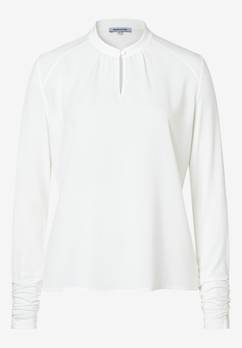 Eine weiße MORE & MORE Bluse mit langen Ärmeln und Knopf am Kragen. Eine weiße MORE & MORE Bluse mit langen Ärmeln und Knopf am Kragen.