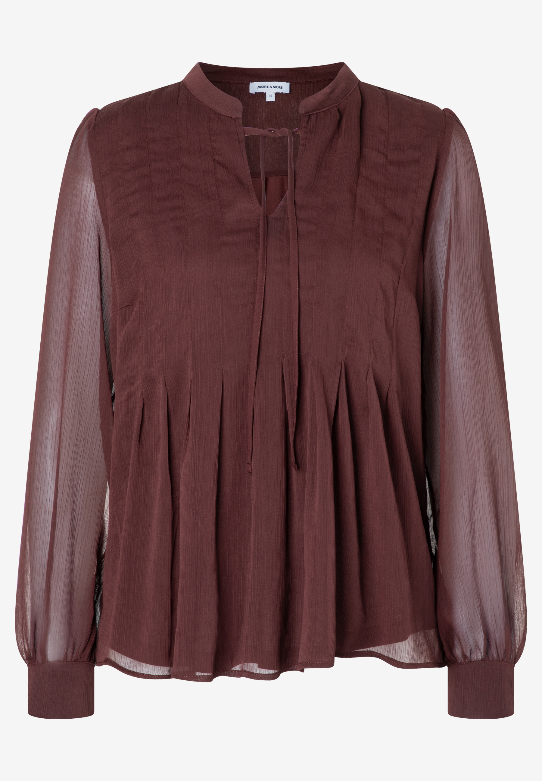 Eine MORE & MORE Bluse aus Chiffon in Braun mit langen, transparenten Ärmeln und V-Ausschnitt mit Bändern. Eine MORE & MORE Bluse aus Chiffon in Braun mit langen, transparenten Ärmeln und V-Ausschnitt mit Bändern.