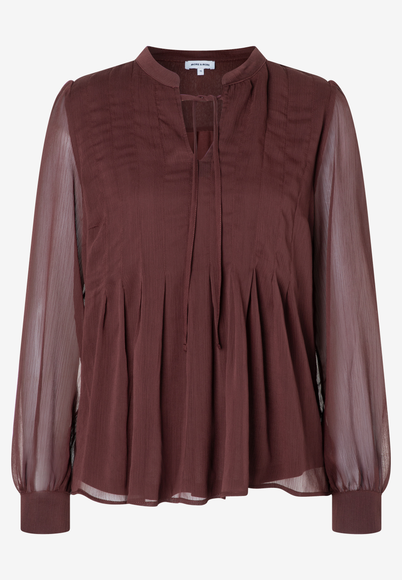 Eine MORE & MORE Bluse aus Chiffon in Braun mit langen, transparenten Ärmeln und V-Ausschnitt mit Bändern. Eine MORE & MORE Bluse aus Chiffon in Braun mit langen, transparenten Ärmeln und V-Ausschnitt mit Bändern.