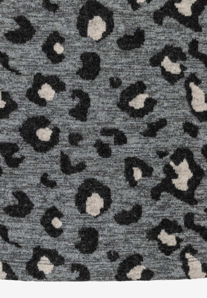 Nahaufnahme eines MORE & MORE Rocks mit grauem Jersey-Jacquard-Leopardenmuster. Nahaufnahme eines MORE & MORE Rocks mit grauem Jersey-Jacquard-Leopardenmuster.