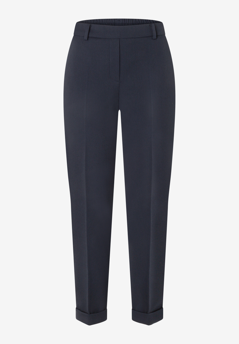 MORE & MORE Jeans: dunkelblaue Hose mit Gummizug und Krempelsaum, vorderseitig mit Falten und Reißverschluss.
