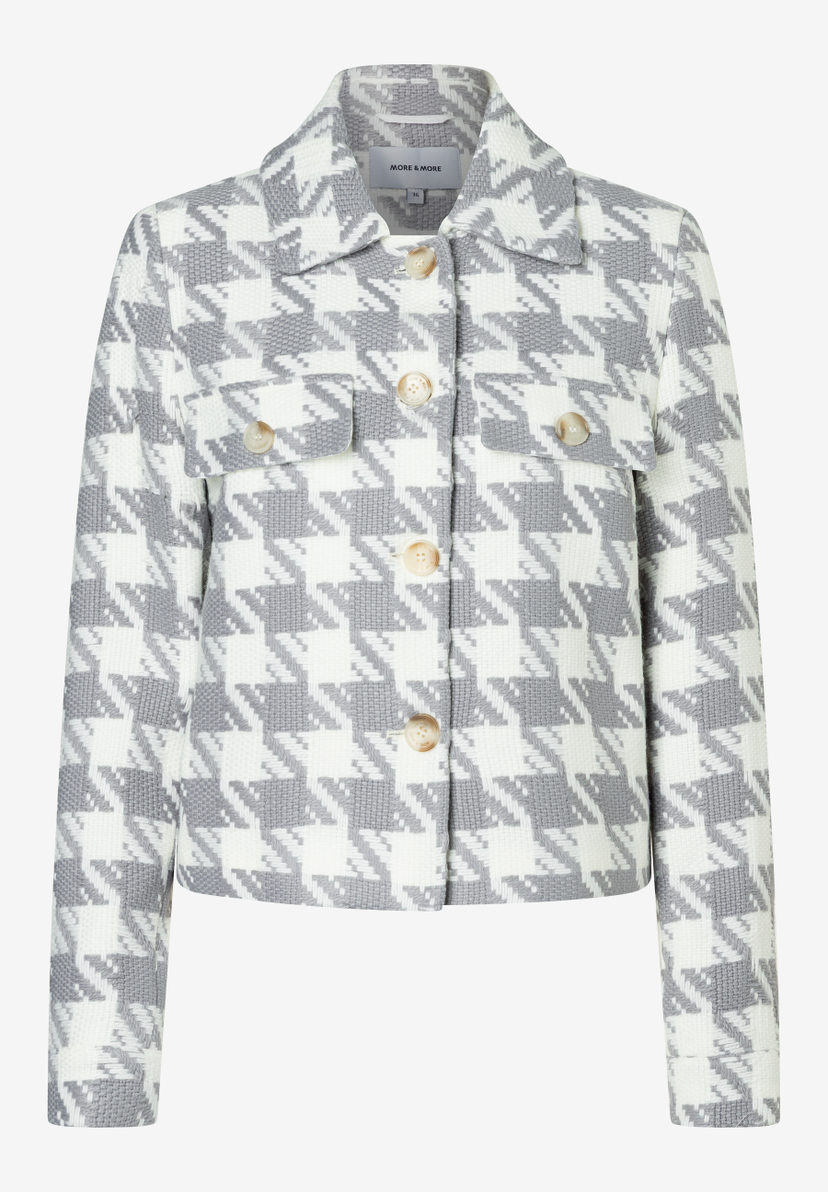 Eine MORE & MORE-Blazerjacke mit grau-weißem Hahnentrittmuster und Knöpfen. Eine MORE & MORE-Blazerjacke mit grau-weißem Hahnentrittmuster und Knöpfen.