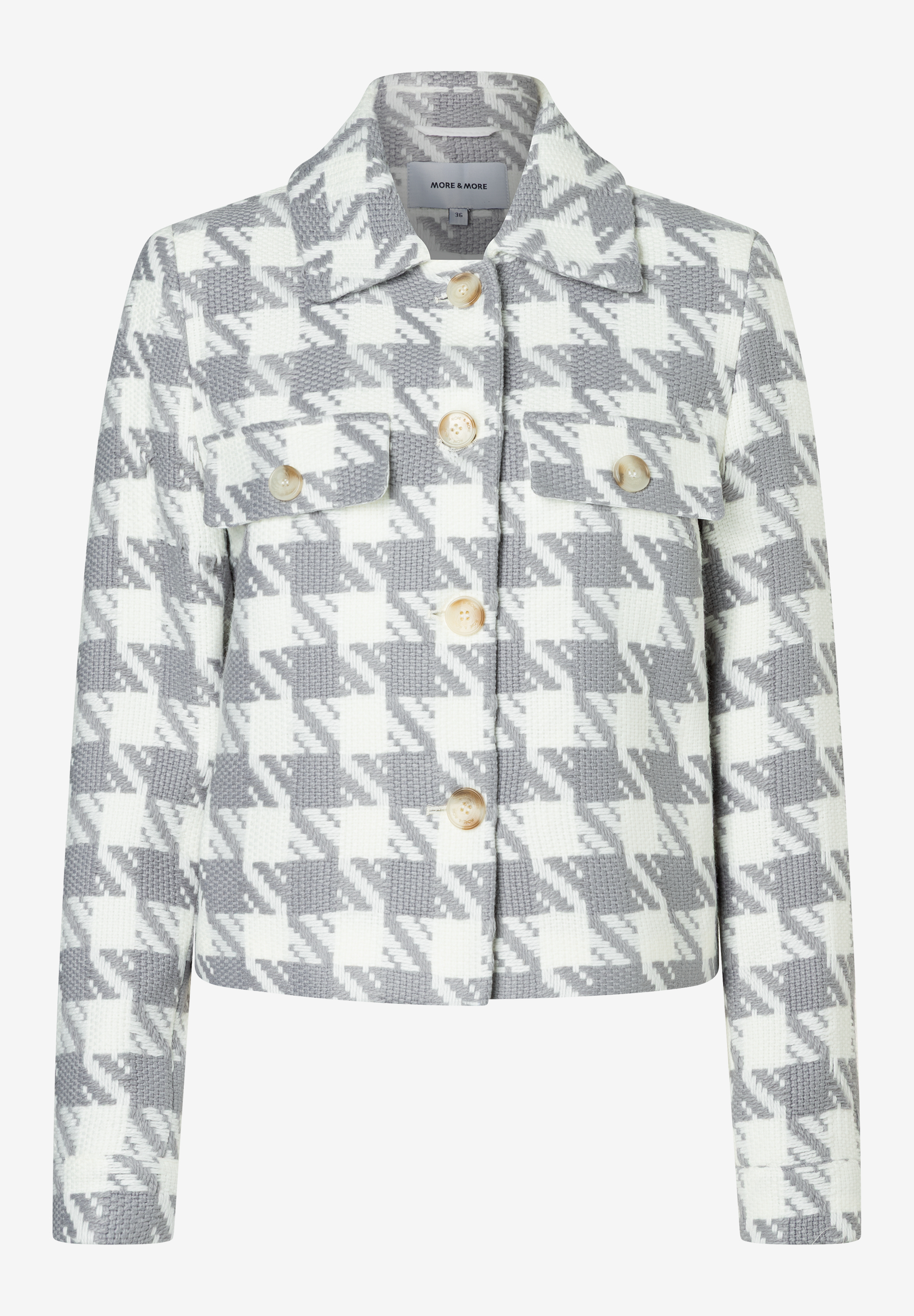 Eine MORE & MORE-Blazerjacke mit grau-weißem Hahnentrittmuster und Knöpfen. Eine MORE & MORE-Blazerjacke mit grau-weißem Hahnentrittmuster und Knöpfen.