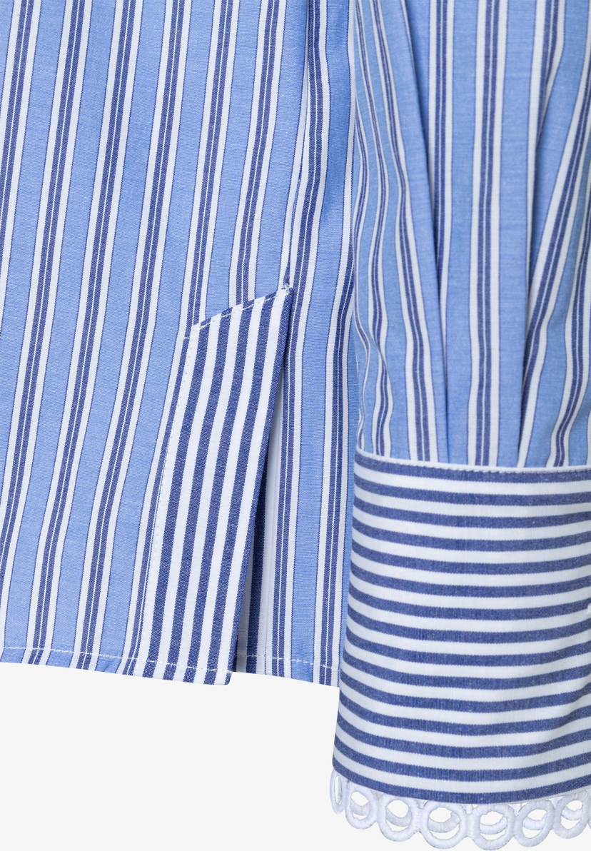 Detailansicht einer gestreiften MORE & MORE Bluse mit Manschette und Seitenschlitz. Detailansicht einer gestreiften MORE & MORE Bluse mit Manschette und Seitenschlitz.